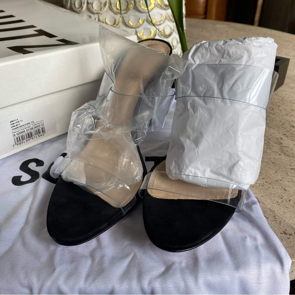 Brand New! Never worn Schultz Ariella Sandals. Black with vinyl upper.